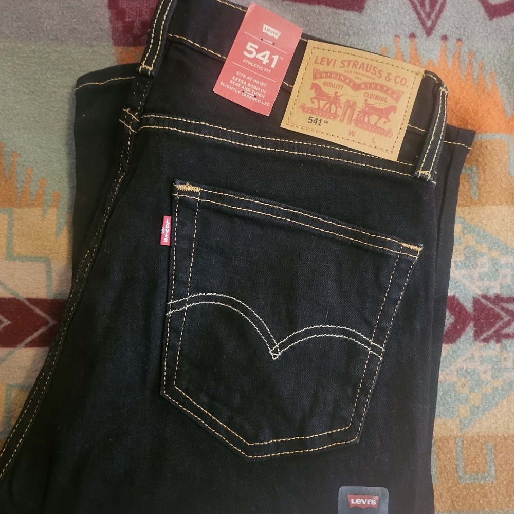 Levi's Dark Indigo Jeans with Gold Stitching and Red Tabs